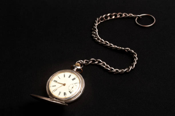 istock old pocket watch with black background 1371743672