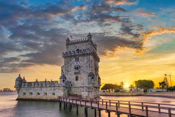 Lisbon Portugal sunset city skyline at Belem Tower and Tagus River stock photo
