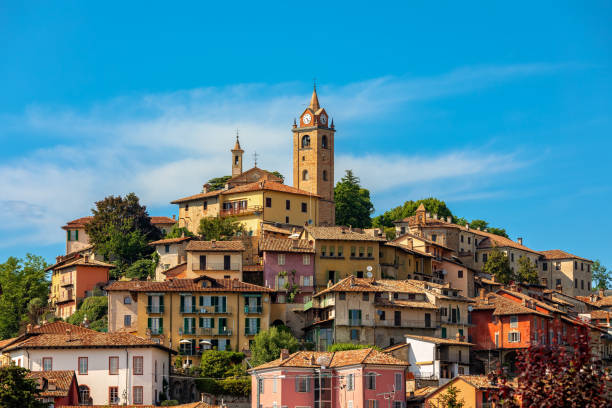 Small town of Monforte d'Alba under blue sky in Italy. stock photo
