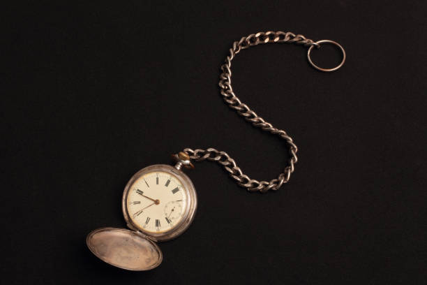 istock old pocket watch with black background 1371744966