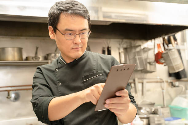 istock Male staff preparing food at a restaurant 1371746679