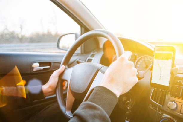 istock Gps navigator map system. Global positioning system on smartphone screen in auto car on travel road. GPS car search location technology. 1371750279