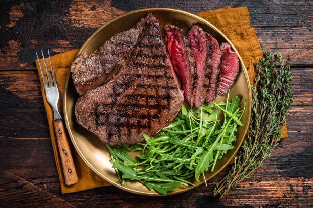 bbq dinner with top sirloin beef steak and salad on a plate. wooden background. top view - circular skirt fotos imagens e fotografias de stock