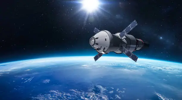 Photo of Spacecraft Orion on orbit of Earth planet. Spaceship in space. Expedition to Moon. Artemis program. Elements of this image furnished by NASA