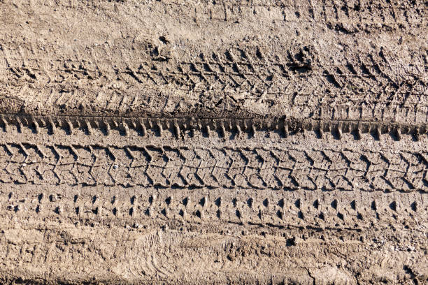 istock automobile tire marks on mud, tire marks on mud, tire tread marks on mud, 1371753945