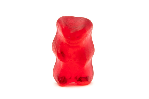 Single jelly gummy bear isolated on white background.