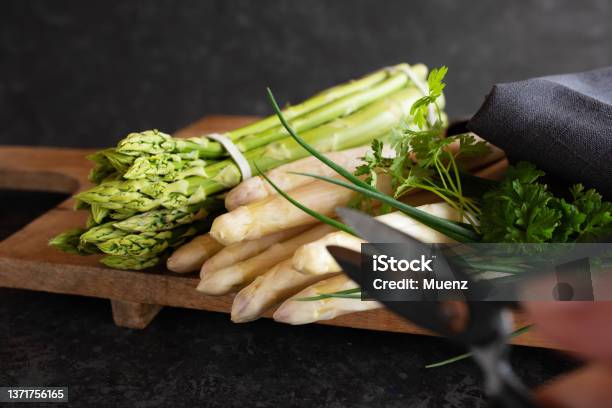 Fresh Asparagus On Wooden Cutting Board Stock Photo - Download Image Now - Asparagus, White Color, Green Color