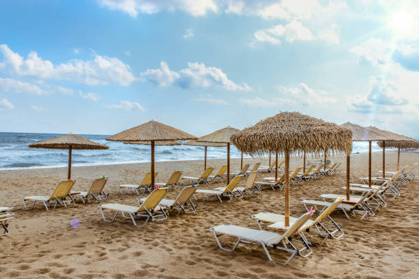 istock Beach with reed umbrellas on a clear sunny day 1371757370