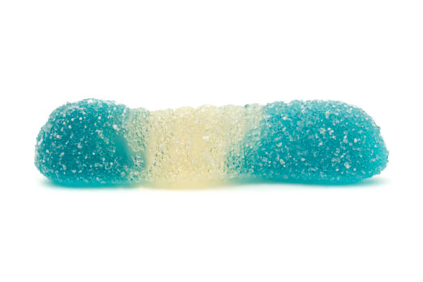 One whole white blue colourful jelly worm candy isolated on white background