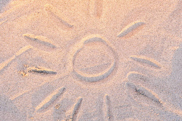 istock children's drawing on the sand on a summer day - the sun 1371761602