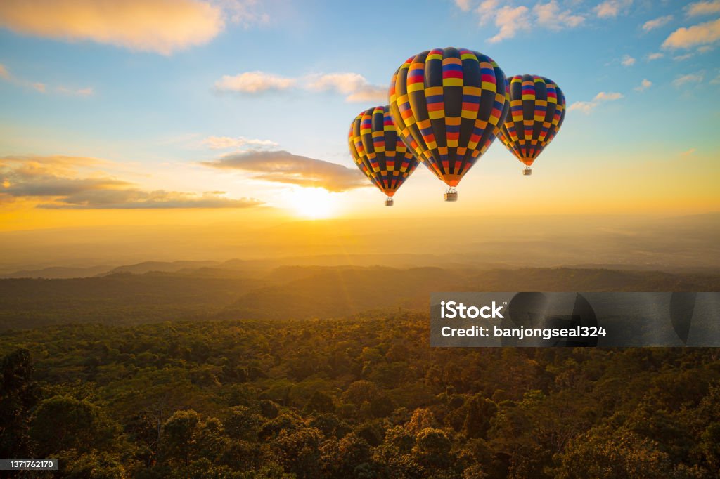 balloon and mountain,Hot air balloons with landscape mountain,Colorful hot air balloon ,Hot Air Balloons Flying at Sunset, Cappadocia, Turkey. High Up Stock Photo
