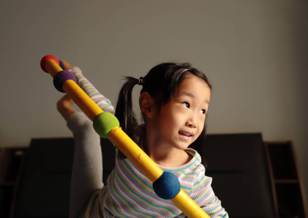 Father and daughter building construction with cubes made of craft sticks and play dough.
