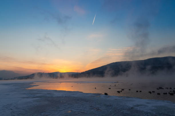 istock First rays of the sun over the winter river 1371764827