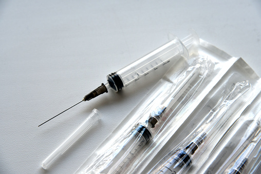 New medical syringes in a package on a white background