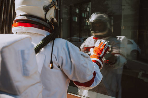 spaceman in a futuristic station. Man with space suit walking in an urban area