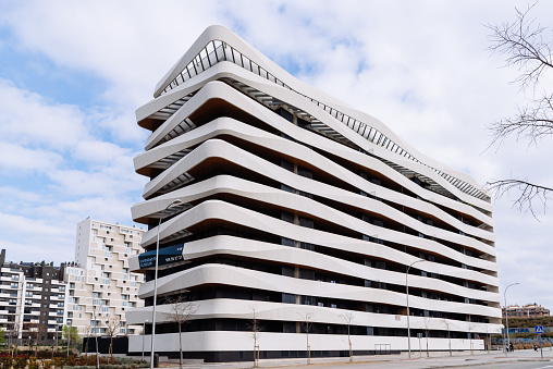 Madrid, Spain - March 7, 2021: New luxury residential building with continuous precast concrete terraces. Mendez Alvaro area