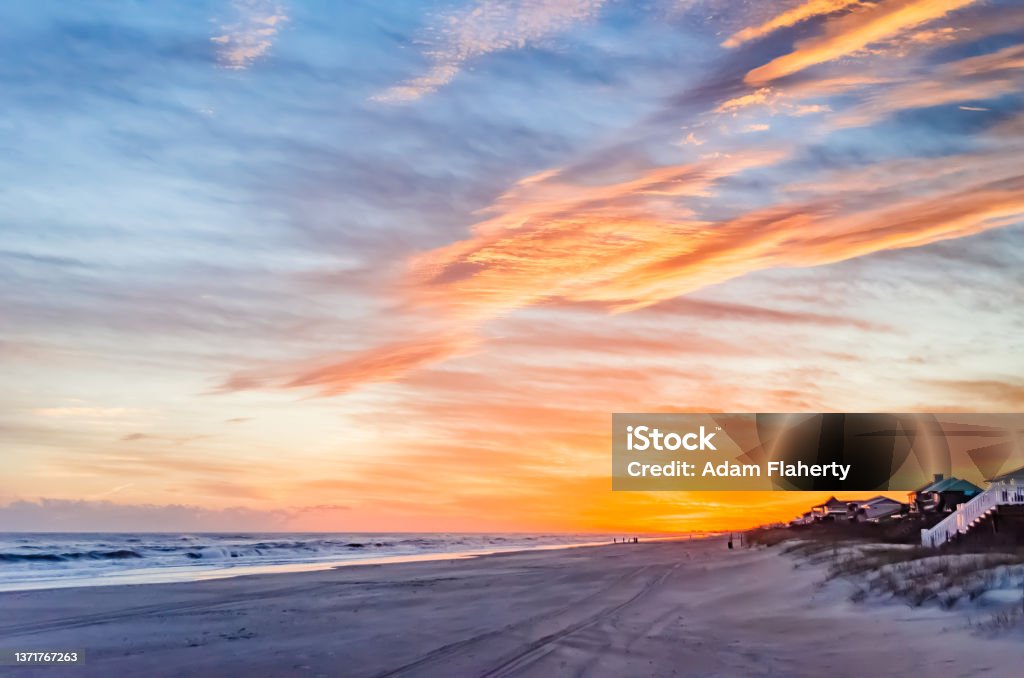 Dusk Beach Scene at Emerald Isle North Carolina Crystal Coast Bogue Banks Waves and Clouds Orange Blue North Carolina - US State Stock Photo