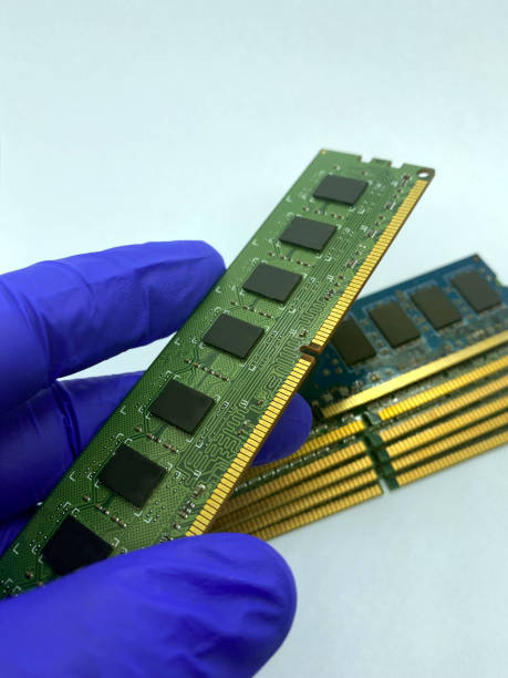 istock RAM chip kept on gloved hand against a stack of RAM chips closeup isolated on white background 1371770048