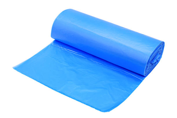 istock Roll of blue plastic garbage bags isolated on a white background 1371773710