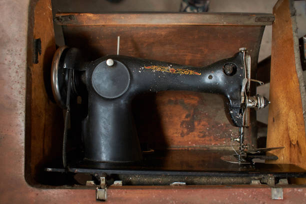 istock Old, retro, vintage sewing machine and on a dark background 1371776750