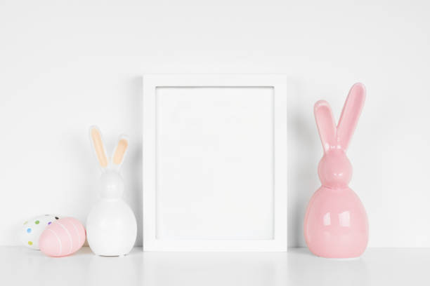istock Mock up portrait white frame with Easter Eggs and modern glass bunny decor 1371780037