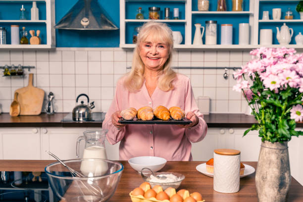 istock Beautiful senior woman baking in the kitchen 1371783215