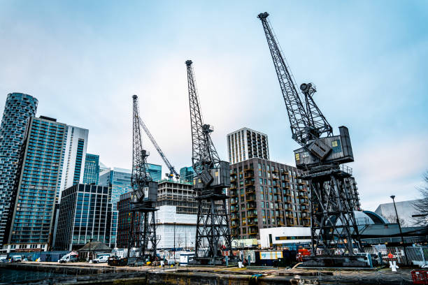 Three tall cranes at Canary Wharf in London