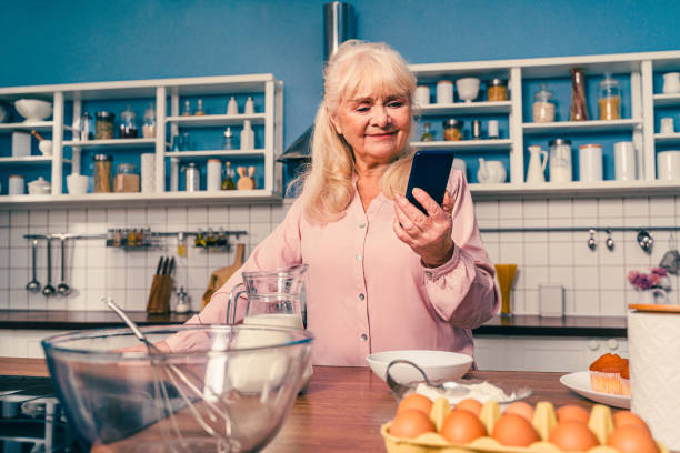istock Beautiful senior woman baking in the kitchen 1371784234