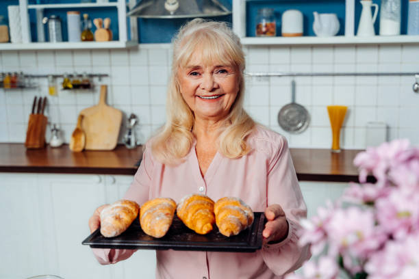 istock Beautiful senior woman baking in the kitchen 1371784272