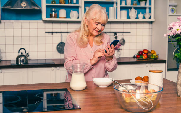 istock Beautiful senior woman baking in the kitchen 1371784954