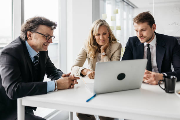 istock Business partners working on a laptop 1371785108