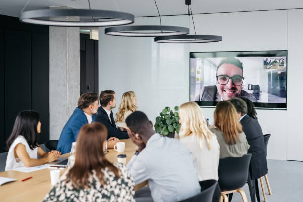 istock Co-workers on a video call with a young businessman 1371786065