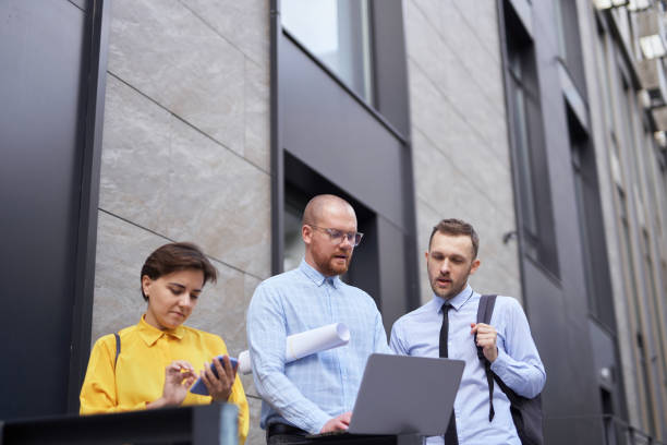 istock Business people discussing project brainstorming outdoor 1371786237
