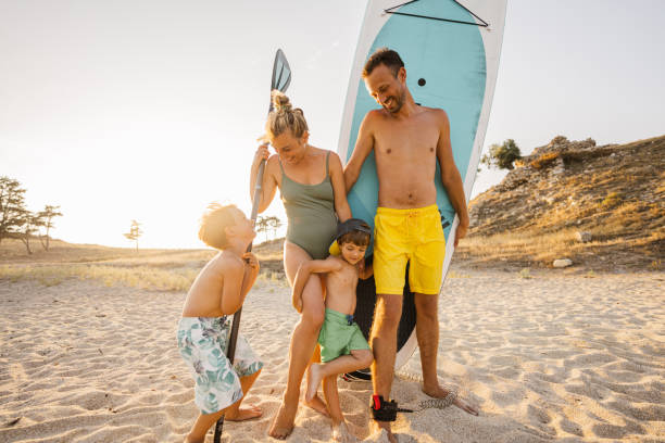 istock Smiling family ready for paddleboarding 1371786402