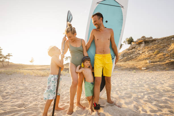 istock Smiling family ready for paddleboarding 1371786441
