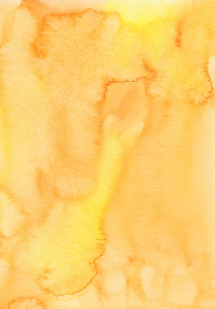 istock Watercolor bright yellow background texture. Watercolour backdrop. Light orange stains on paper, hand painted. 1371786727