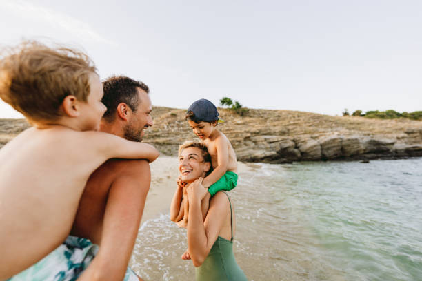 istock Piggyback ride at the beach 1371786815