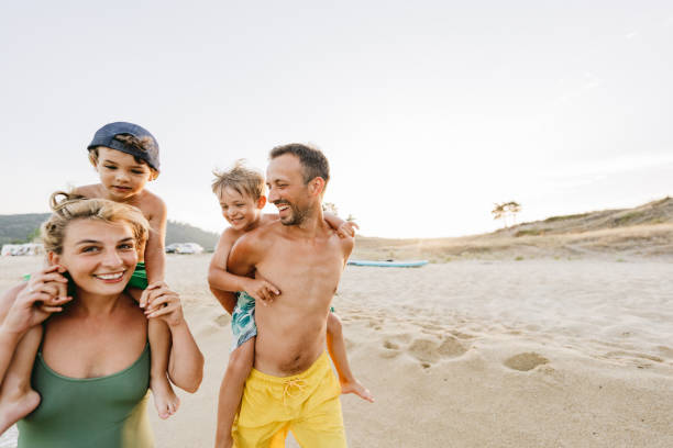 istock Piggyback ride at the beach 1371786905