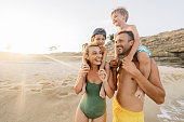 istock Four of us at the beach 1371786982