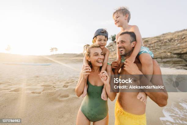 Four Of Us At The Beach Stock Photo - Download Image Now - Family, Beach, Summer