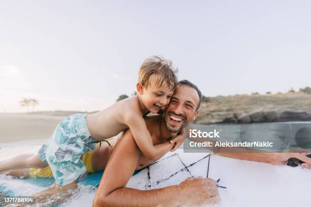 Partners For Fun Adventures Stock Photo - Download Image Now - Greece, Father, Surfing