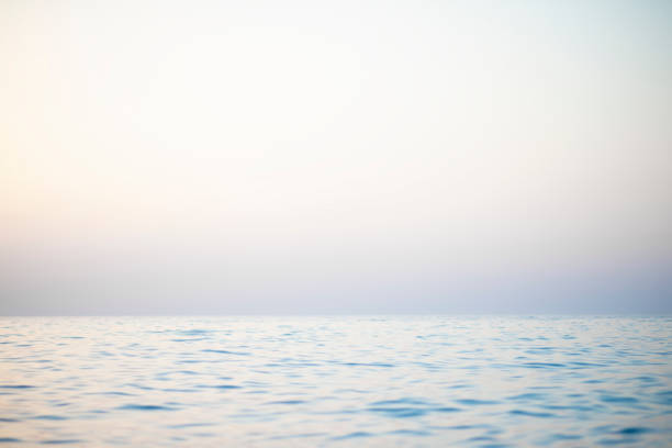istock Abstract sunset sky and ocean nature background with blurred panning motion. 1371790061