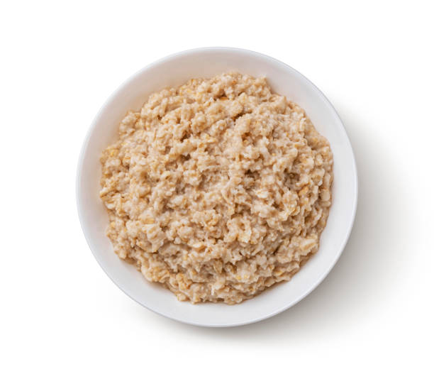 ciotola di farina d'avena isolata su sfondo bianco, vista dall'alto - oatmeal heat bowl breakfast foto e immagini stock