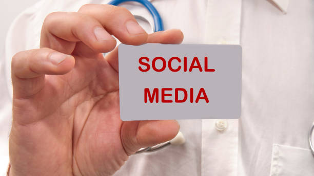 social media the text on the card in the man's hand.