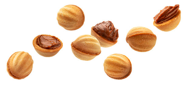 istock Nuts cookies isolated on white background 1371791022