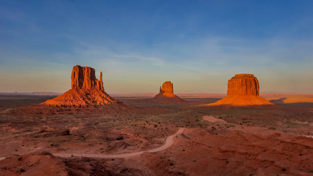 istock Sunset overlooking Mitten and Merrick Buttes at Monument Valley 1371791735
