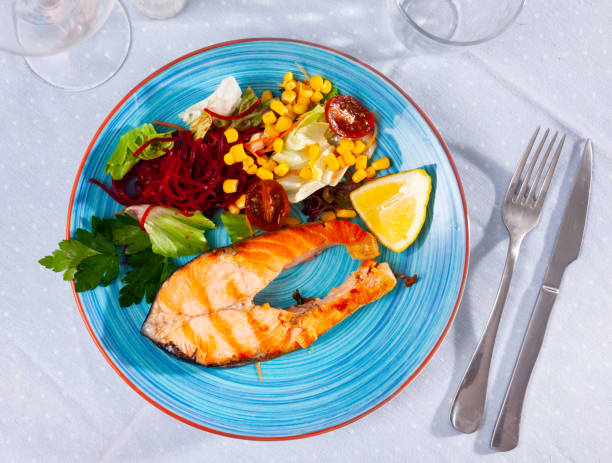 istock Grilled salmon steak with vegetable salad 1371792991