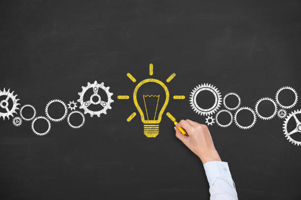 istock Creative idea concepts with light bulbs on a chalkboard background 1371795456