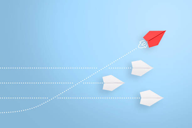istock Change concepts with red paper airplane leading among white 1371795813