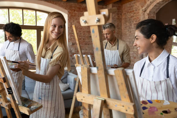 istock Happy diverse people enjoying creative art class. 1371797965